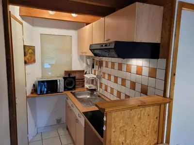 Cuisine ou kitchenette dans l'établissement Gîte Mélisse