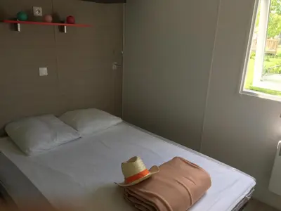 Un ou plusieurs lits dans un hébergement de l'établissement Camping Campilo - Maeva
