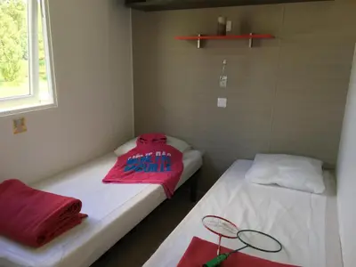 Un ou plusieurs lits dans un hébergement de l'établissement Camping Campilo - Maeva