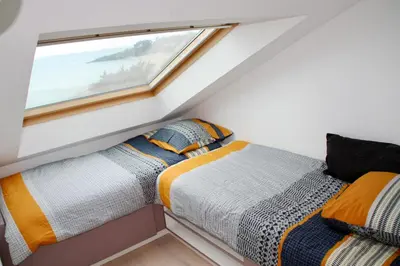 Un ou plusieurs lits dans un hébergement de l'établissement Duplex face mer tout confort sur la plage /tennis