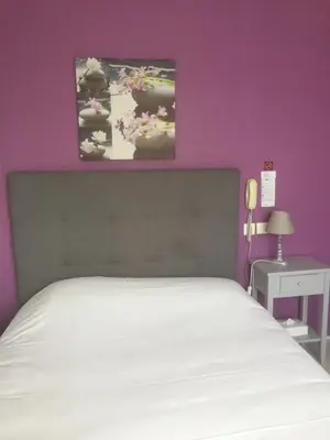 Un ou plusieurs lits dans un hébergement de l'établissement Auberge du Calvaire