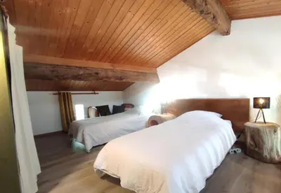 Un ou plusieurs lits dans un hébergement de l'établissement Mini-loft