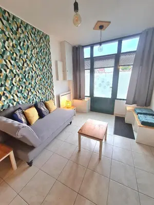 Coin salon dans l'établissement Appartement Samuel centre ville Les Herbiers, 10 min du Puy du Fou