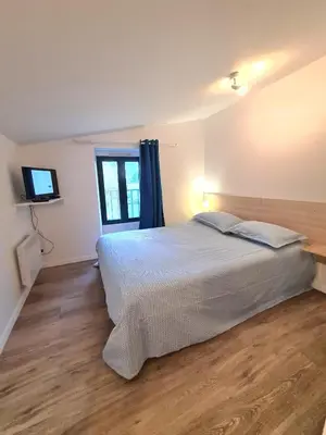 Un ou plusieurs lits dans un hébergement de l'établissement Appartement Samuel centre ville Les Herbiers, 10 min du Puy du Fou