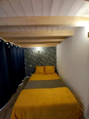 Un ou plusieurs lits dans un hébergement de l'établissement Gîte 'Chez Joseph et Cie' -8 mn du Puy du Fou