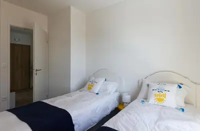 Un ou plusieurs lits dans un hébergement de l'établissement Face à la mer - 50 m de la plage des homardiers