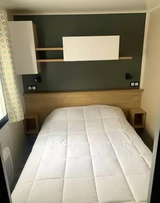 Un ou plusieurs lits dans un hébergement de l'établissement Bungalow confortable à Saint-Jean-de-Monts avec piscine partagée