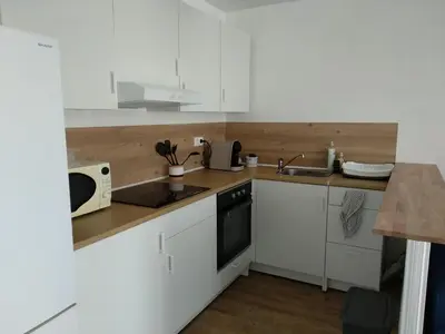 Cuisine ou kitchenette dans l'établissement La Petite Maison