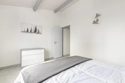 Un ou plusieurs lits dans un hébergement de l'établissement Appartement pour 4 - 450m Plage des Sables d'Or