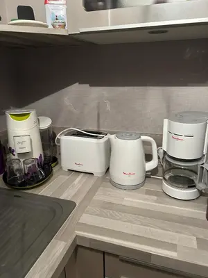 Cuisine ou kitchenette dans l'établissement Appartement ST JEAN Centre Ville Wifi Balcon Parking