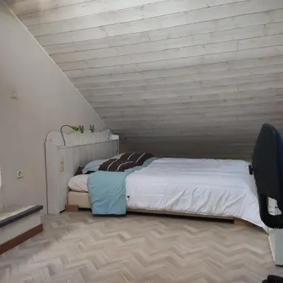 Un ou plusieurs lits dans un hébergement de l'établissement Maison et jardin Nantes Chantenay
