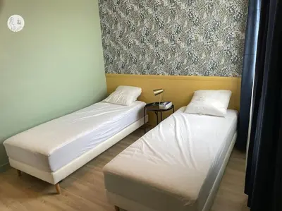 Un ou plusieurs lits dans un hébergement de l'établissement Au85, Bel appartement, vue océan, pied de la plage