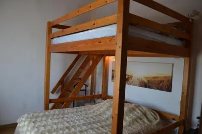 Un ou plusieurs lits dans un hébergement de l'établissement NOIRMOUTIER : LOCATION DE VACANCES POUR 8 PERSONNES À BARBÂTRE