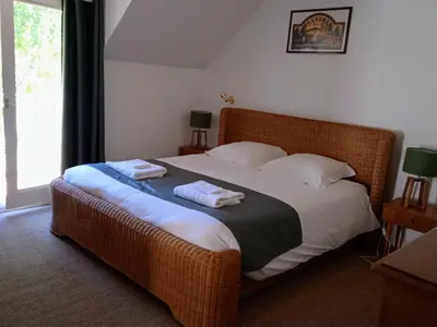 Un ou plusieurs lits dans un hébergement de l'établissement Cottage sur le Domaine du golf de la Bretesche