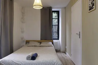 Un ou plusieurs lits dans un hébergement de l'établissement Studio Cosy Hyper centre - Fibre - Netflix
