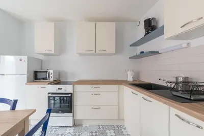 Cuisine ou kitchenette dans l'établissement Le Clémenceau - Centre-ville - Wifi