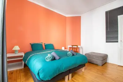 Un ou plusieurs lits dans un hébergement de l'établissement Superbe Appartement Calme 85m², à deux pas du Centre
