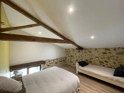 Un ou plusieurs lits dans un hébergement de l'établissement Gîte de la Foye - Le Jasmin