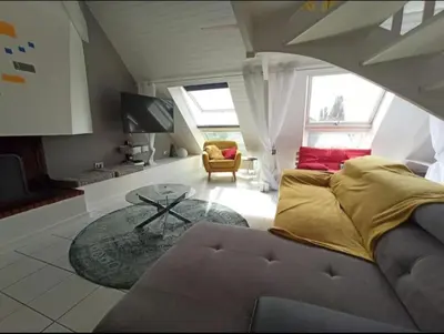Coin salon dans l'établissement Superbe loft 90m² proche parc expo Nantes (6p)