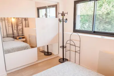 Un ou plusieurs lits dans un hébergement de l'établissement Maison avec terrasse plein sud à 7 min de la gare
