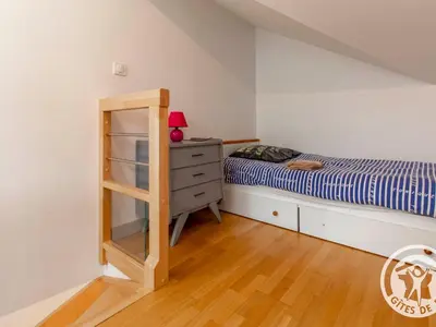 Un ou plusieurs lits dans un hébergement de l'établissement Gîte charmant avec jardin au cœur du vignoble du Layon, proche Saumur, 9 couchages, vélos inclus - FR-1-622-19