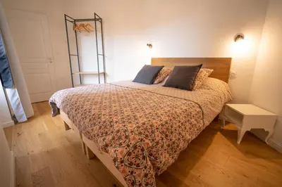 Un ou plusieurs lits dans un hébergement de l'établissement Appartement cosy en cœur de bourg