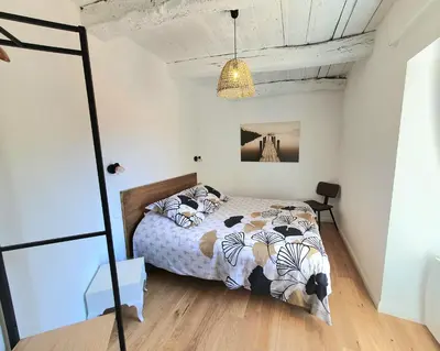 Un ou plusieurs lits dans un hébergement de l'établissement Appartement cosy en cœur de bourg