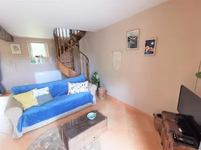 Télévision ou salle de divertissement dans l'établissement Gîte à la campagne