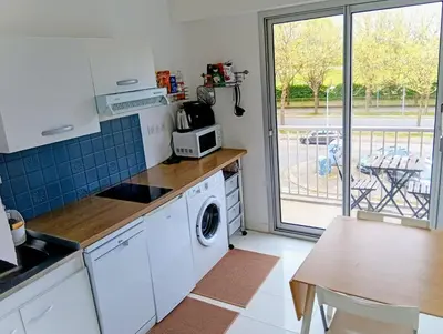 Cuisine ou kitchenette dans l'établissement T1 parc paysager St Nazaire