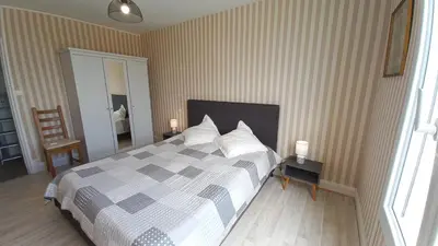 Un ou plusieurs lits dans un hébergement de l'établissement LES FLOTS BLEUS - Appartement 2 chambres vue mer