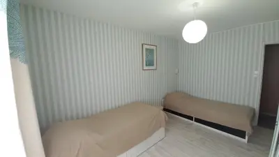 Un ou plusieurs lits dans un hébergement de l'établissement LES FLOTS BLEUS - Appartement 2 chambres vue mer
