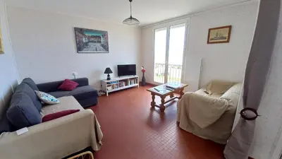 Coin salon dans l'établissement LES FLOTS BLEUS - Appartement 2 chambres vue mer