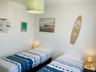 Un ou plusieurs lits dans un hébergement de l'établissement Maison de l'océan, convivialité et plage à 300m