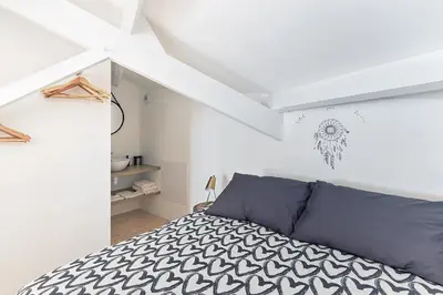 Un ou plusieurs lits dans un hébergement de l'établissement La Galerie Pornic - Maison Cedre
