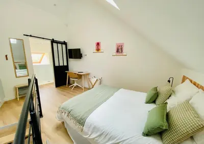 Un ou plusieurs lits dans un hébergement de l'établissement Duplex avec parking proche Stade de la Beaujoire, parc des expositions, bord de l'Erdre