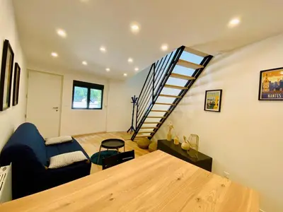 Coin salon dans l'établissement Duplex avec parking proche Stade de la Beaujoire, parc des expositions, bord de l'Erdre