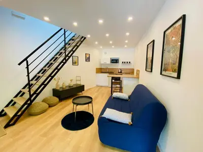 Coin salon dans l'établissement Duplex avec parking proche Stade de la Beaujoire, parc des expositions, bord de l'Erdre