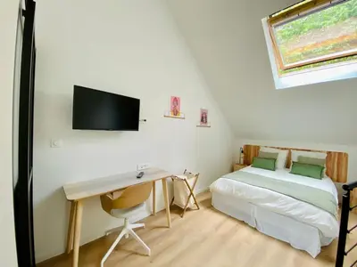 Un ou plusieurs lits dans un hébergement de l'établissement Duplex avec parking proche Stade de la Beaujoire, parc des expositions, bord de l'Erdre