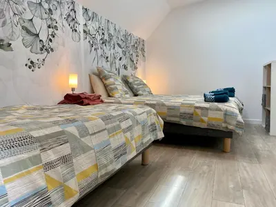 Un ou plusieurs lits dans un hébergement de l'établissement Charmant Duplex Rénové au Cœur de St Joachim, proche Parc de Brière et Plages - FR-1-306-1222
