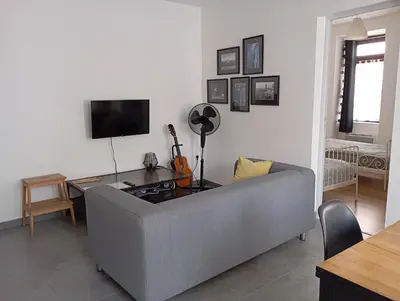 Télévision ou salle de divertissement dans l'établissement La Petite Florentine