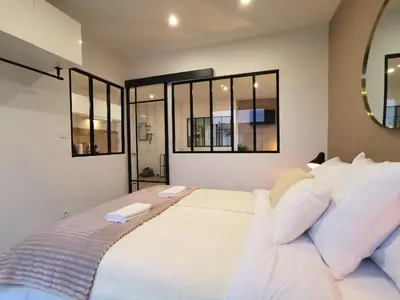 Un ou plusieurs lits dans un hébergement de l'établissement Appartement T2 Cocooning, Secteur Doutre