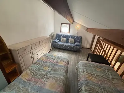 Un ou plusieurs lits dans un hébergement de l'établissement Maisonnette hameau des pins