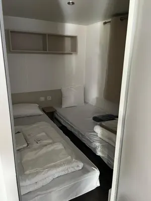Un ou plusieurs lits dans un hébergement de l'établissement Location mobil home saison 2023