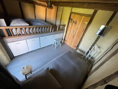 Un ou plusieurs lits dans un hébergement de l'établissement Gîte avec piscine intérieur, Le Repère de Choiseau