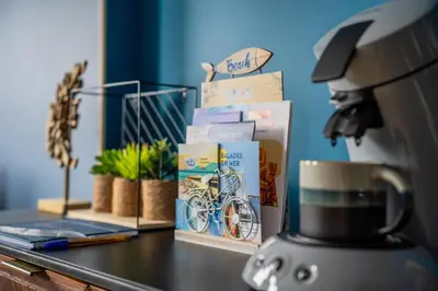 Cuisine ou kitchenette dans l'établissement L'Effet-Mer - Fonctionnel au Cœur de la Ville