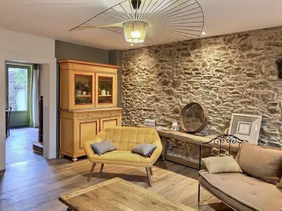 Coin salon dans l'établissement Maison l'or du temps, gîte les Glycines