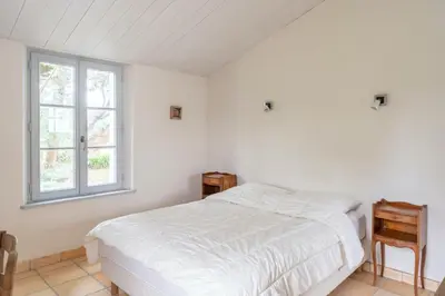 Un ou plusieurs lits dans un hébergement de l'établissement Les Joublanchas : Maison familiale mer et campagne pour 16