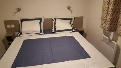 Un ou plusieurs lits dans un hébergement de l'établissement Agréable Mobilhome 6 - 8 places