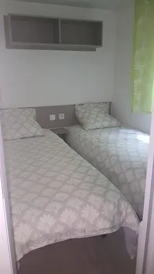 Un ou plusieurs lits dans un hébergement de l'établissement Agréable Mobilhome 6 - 8 places