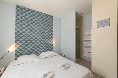 Un ou plusieurs lits dans un hébergement de l'établissement La Roche Bleue - 100m plage - Parking